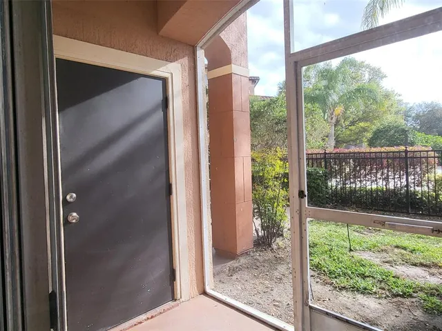 a couple of cars parked in front of a building