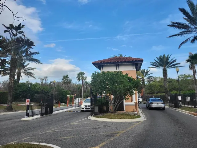 a view of a house with a garden and pathway