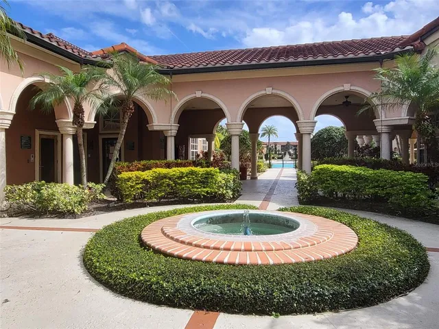 a room with pool table and windows