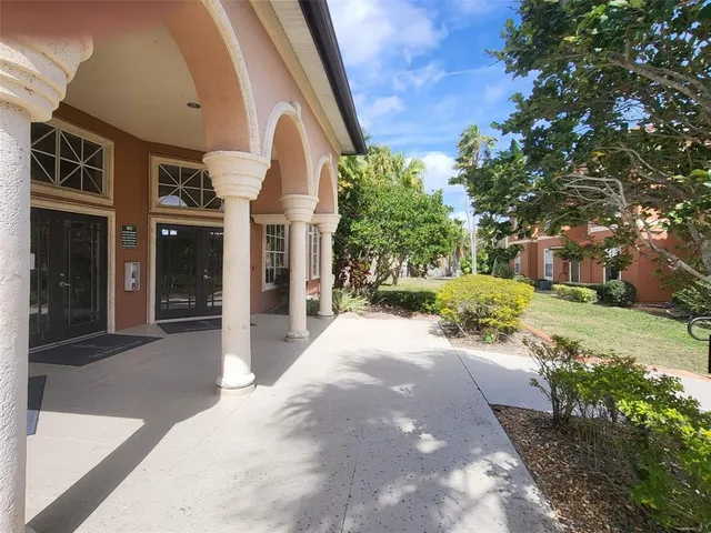 a view of a potted plant in front of a building