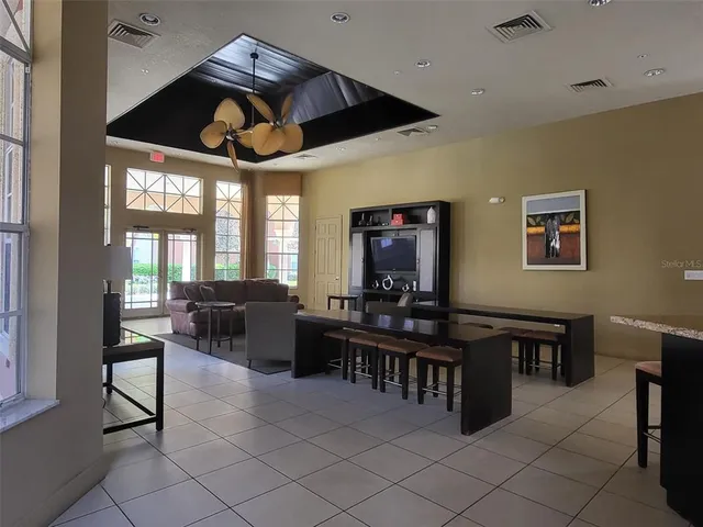 a swimming pool with outdoor seating and yard