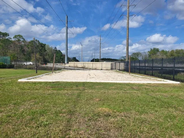 a front view of multi story residential apartment building with yard