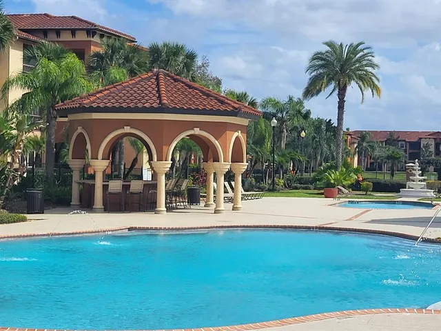 a view of a swimming pool with a yard