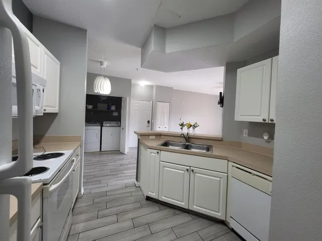 a kitchen with a sink and cabinets