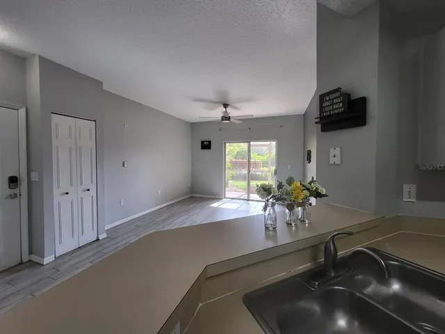 a room with a chandelier furniture and windows