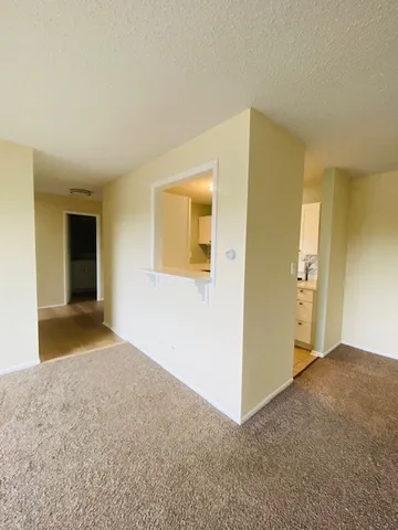 a view of an empty room and window