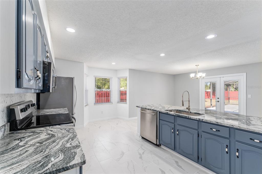5041 Northeast 4th Street Ocala, FL 34470 - Photo 28 of 70 a large bathroom with a sink double vanity and a mirror
