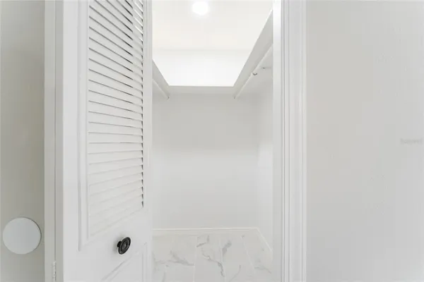 a view of an empty room with sliding door