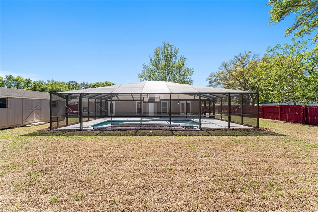 5041 Northeast 4th Street Ocala, FL 34470 - Photo 60 of 70 a swimming pool with outdoor seating and yard
