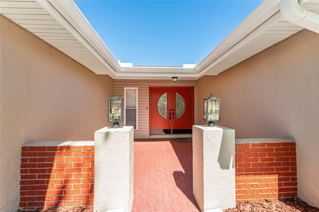 5041 Northeast 4th Street Ocala, FL 34470 - Photo 6 of 70 a front view of a house with garden