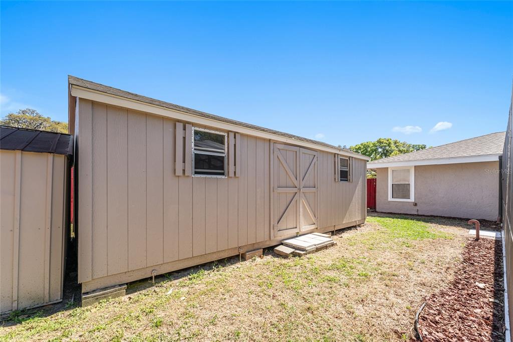 5041 Northeast 4th Street Ocala, FL 34470 - Photo 64 of 70 a view of a backyard of a house