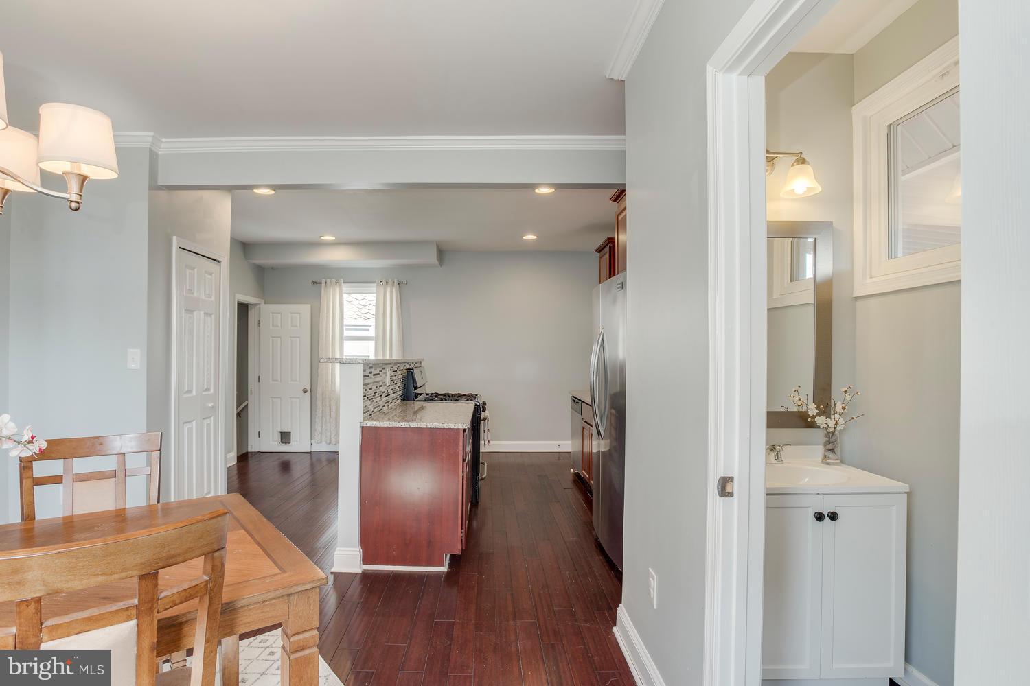 2403 East Cold Spring Lane Baltimore, MD 21214 - Photo 11 of 29 Kitchen/Dining area with adjacent half bath