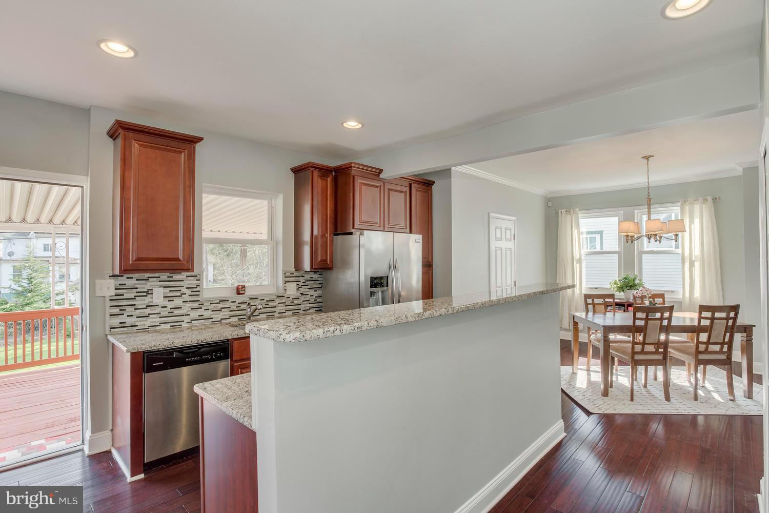 2403 East Cold Spring Lane Baltimore, MD 21214 - Photo 15 of 29 Kitchen with access to rear deck and fenced yard
