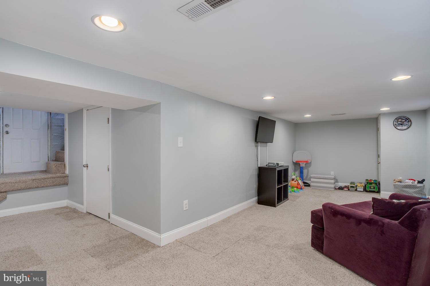 2403 East Cold Spring Lane Baltimore, MD 21214 - Photo 26 of 29 Lower Level Family Room with exterior door