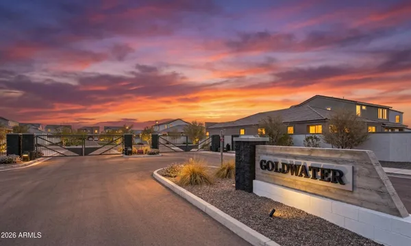 a view of a street with a house in the background