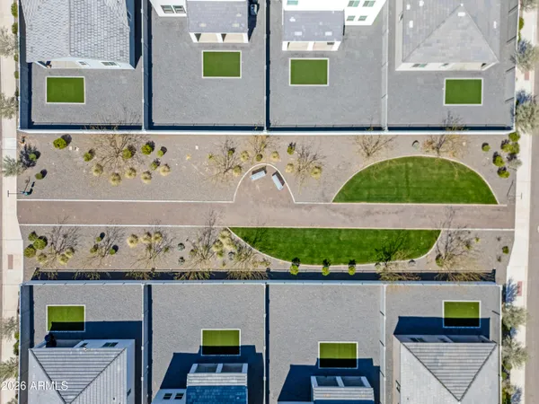 a view of a garden with a house