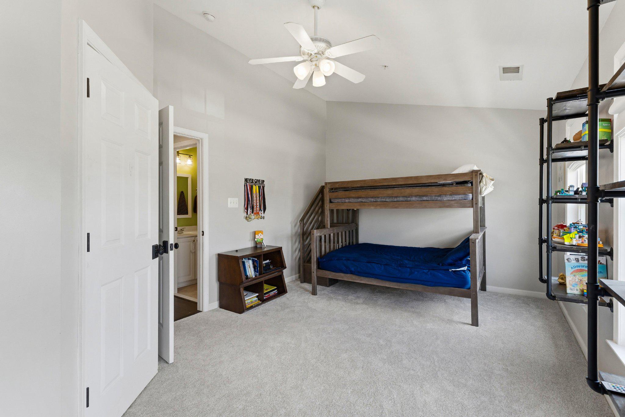 2668 Merlin Court Odenton, MD 21113 - Photo 22 of 42 a bedroom with a bed and a book shelf