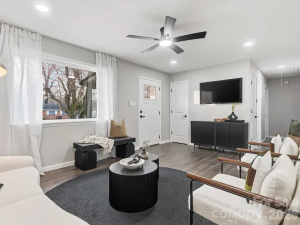 a living room with furniture and a flat screen tv