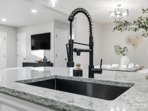 a kitchen with a faucet a sink and a microwave
