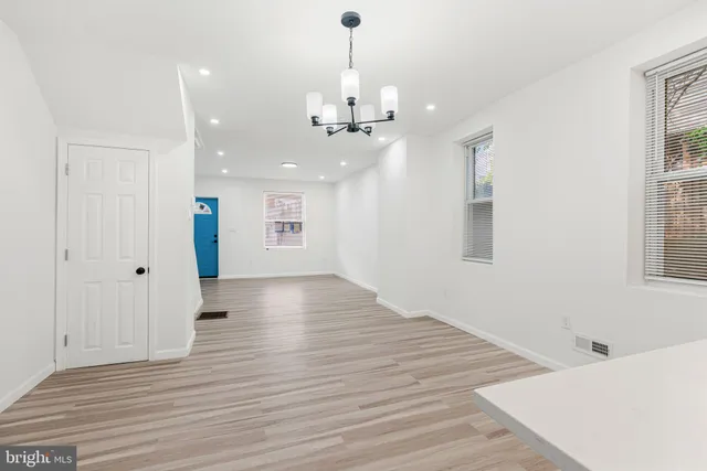 a kitchen with stainless steel appliances granite countertop a refrigerator a sink a stove and oven