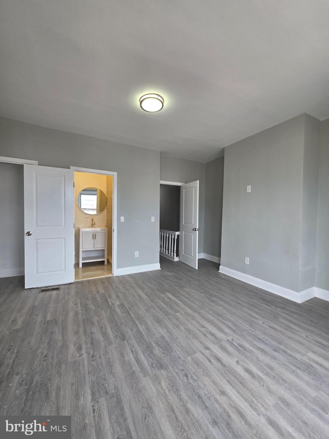 6026 Irving Street Philadelphia, PA 19139 - Photo 15 of 30 a view of an empty room with wooden floor and window
