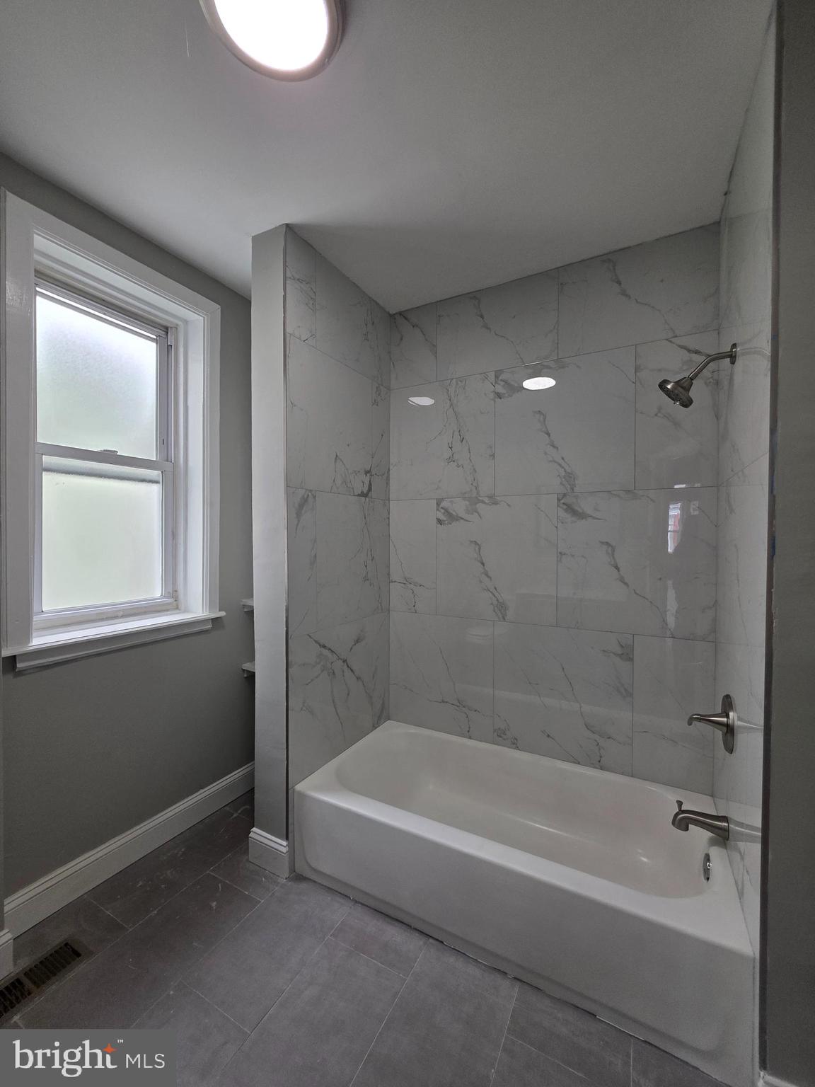 6026 Irving Street Philadelphia, PA 19139 - Photo 26 of 30 a bathroom with a bathtub and a shower