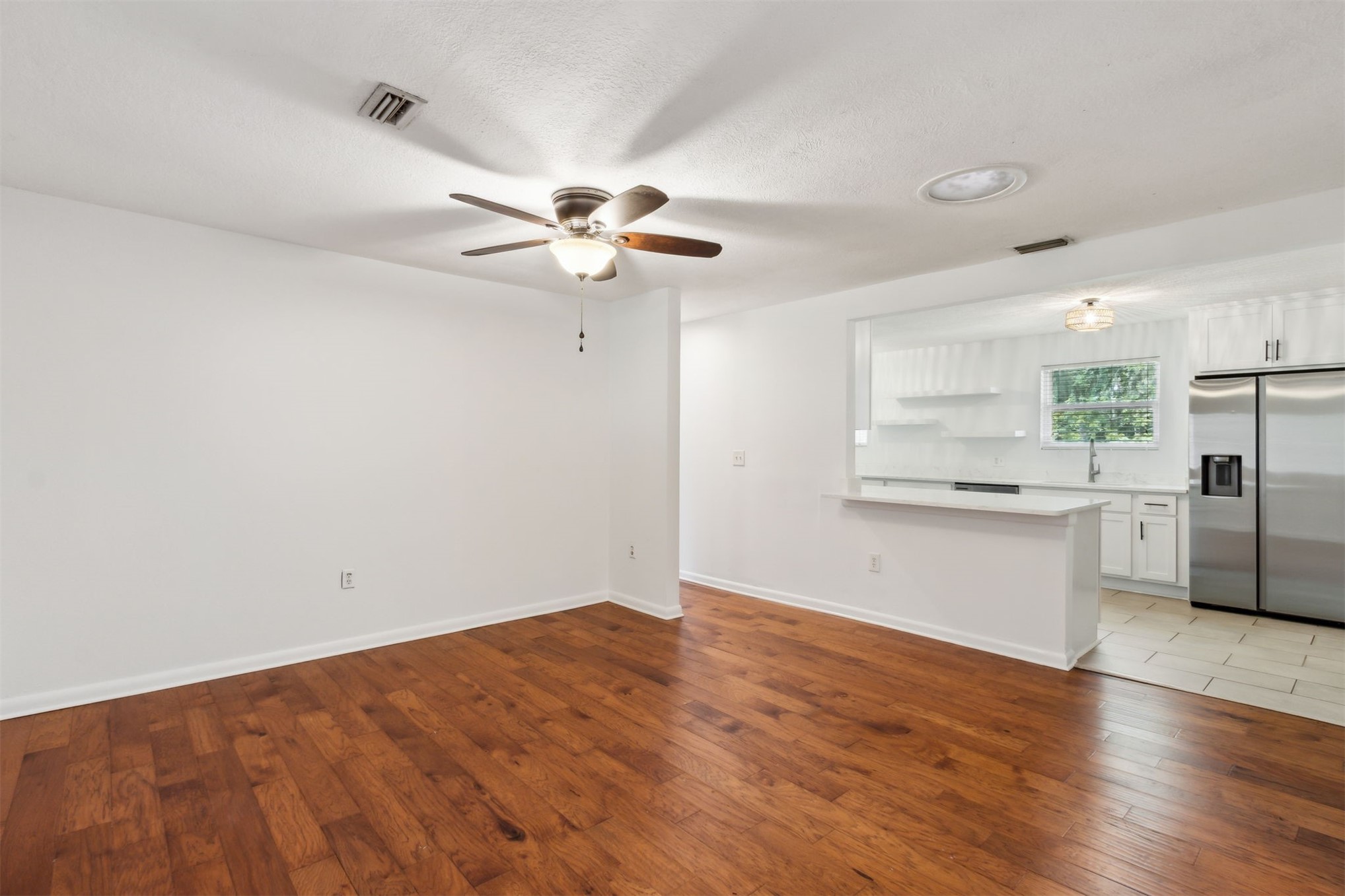 2441 Amelia Road Fernandina Beach, FL 32034 - Photo 11 of 36 a view of a kitchen with a dishwasher and a refrigerator