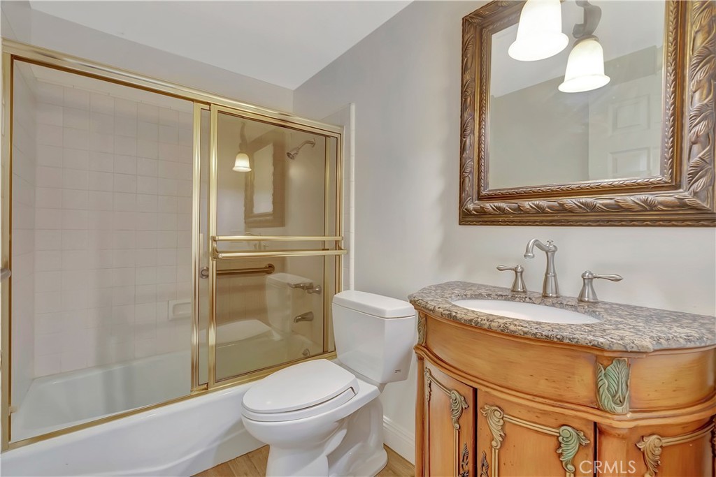 119 Bell Cyn Road Bell Canyon, CA 91307 - Photo 11 of 18 a bathroom with a granite countertop sink toilet and shower