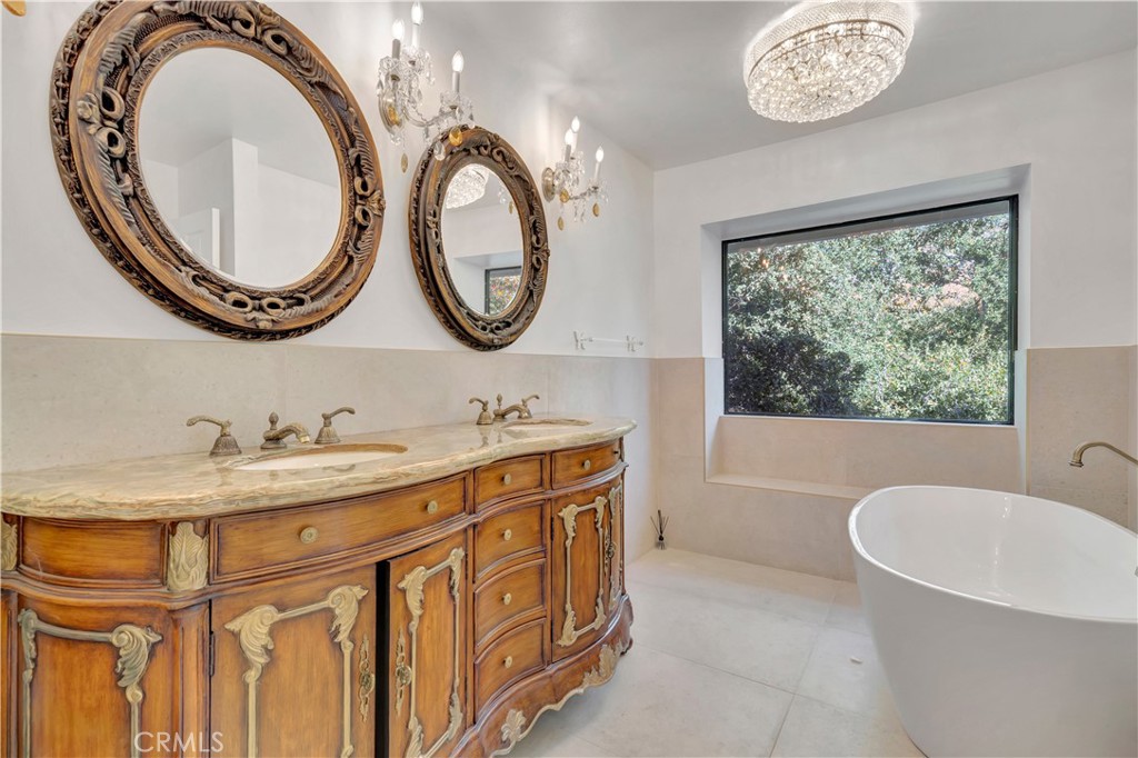 119 Bell Cyn Road Bell Canyon, CA 91307 - Photo 13 of 18 a bathroom with a granite countertop sink and a mirror