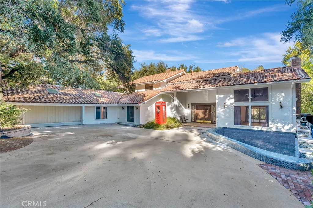 119 Bell Cyn Road Bell Canyon, CA 91307 - Photo 2 of 18 a front view of a house with a yard