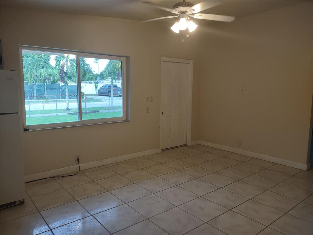 128 Miami Gardens Road West Park, FL 33023 - Photo 14 of 38 a view of an empty room with a window