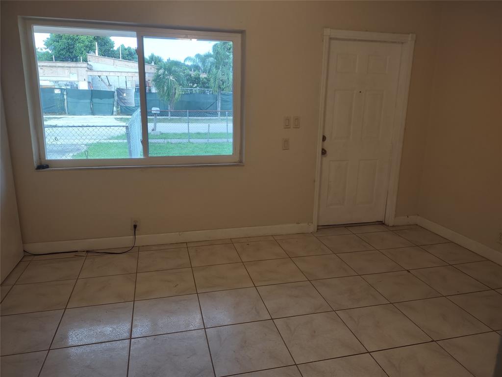 128 Miami Gardens Road West Park, FL 33023 - Photo 15 of 38 a view of an empty room with a window