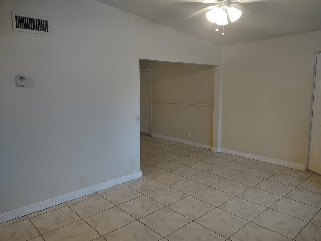 128 Miami Gardens Road West Park, FL 33023 - Photo 21 of 38 an empty room with chandelier fan