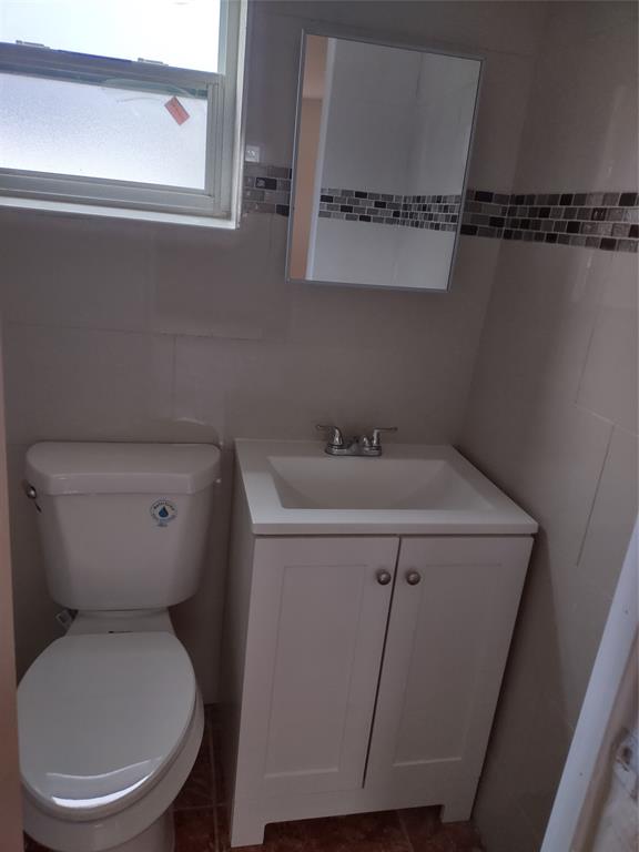 128 Miami Gardens Road West Park, FL 33023 - Photo 25 of 38 a close view of a toilet in a bathroom