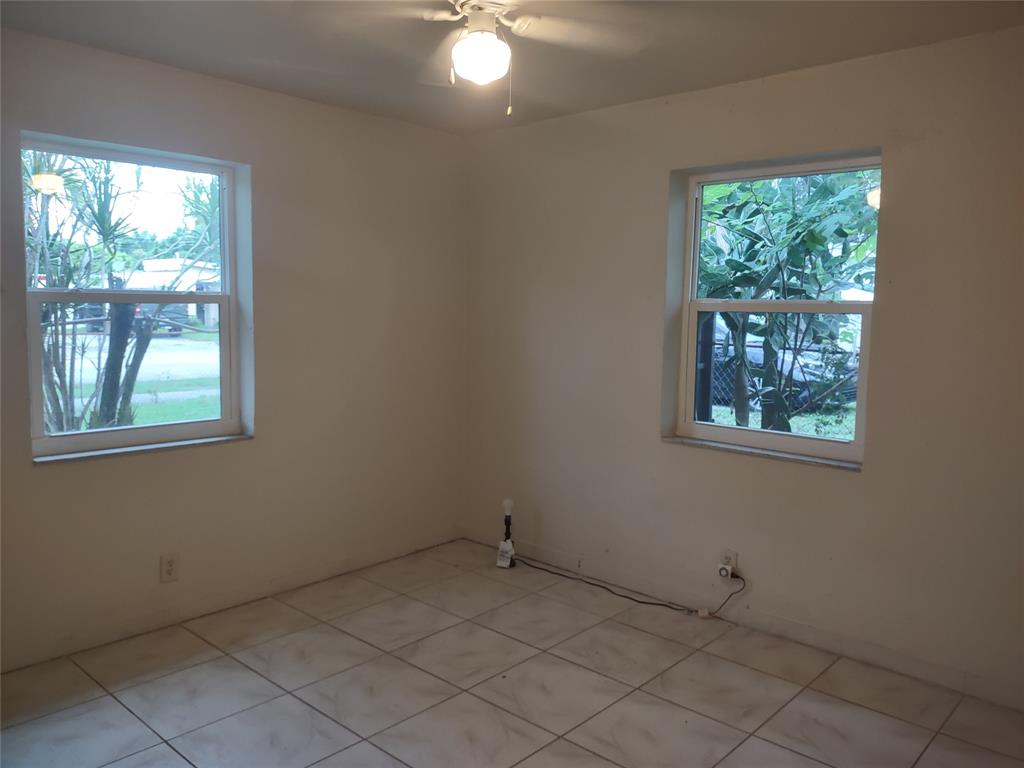 128 Miami Gardens Road West Park, FL 33023 - Photo 29 of 38 a view of an empty room and window