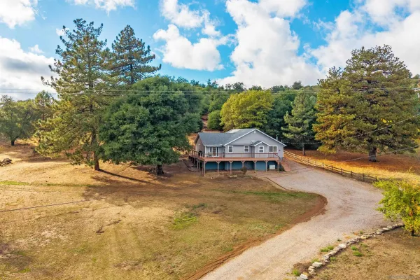 a house with trees in the background