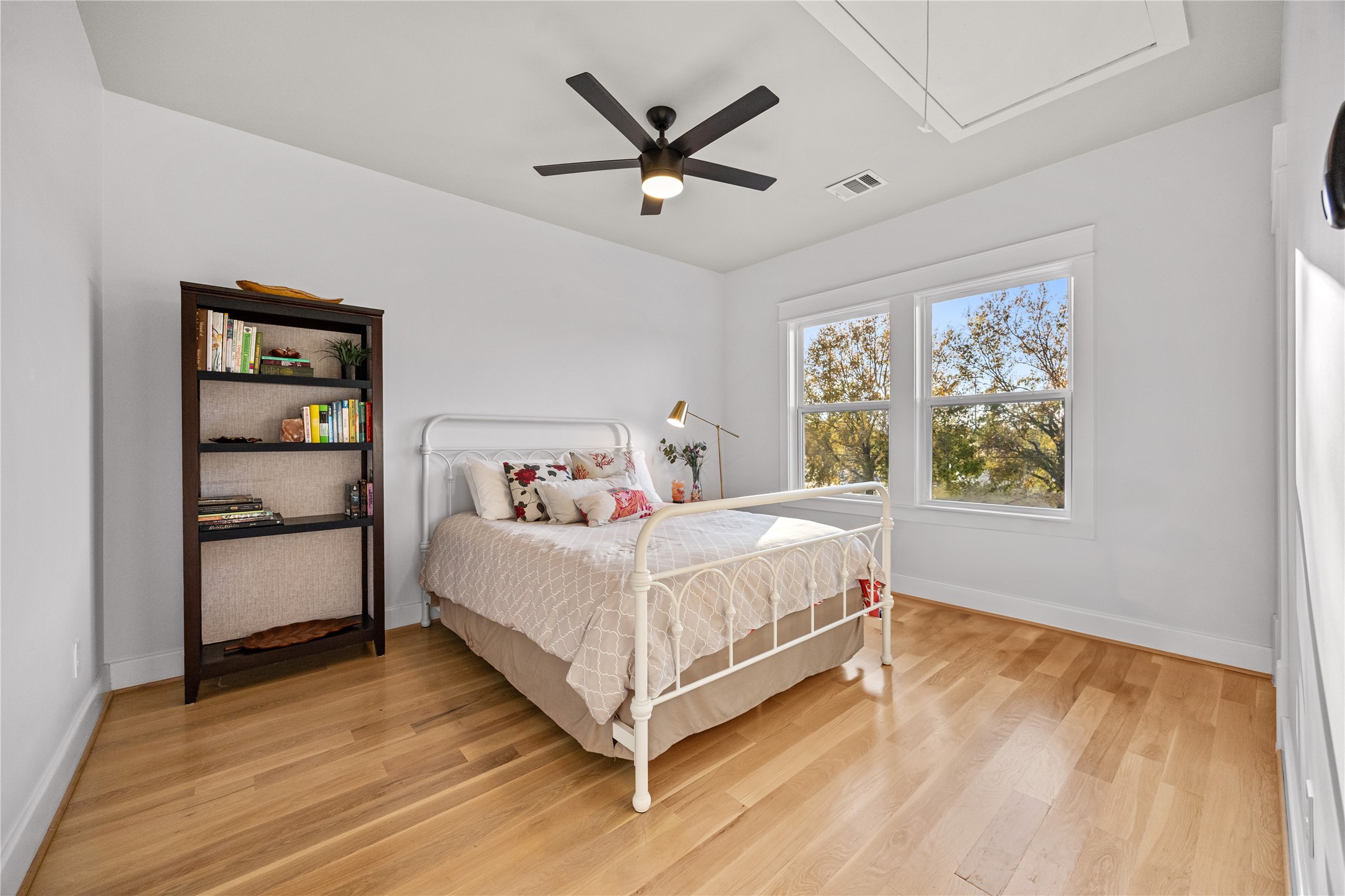 910 Northwood Street Houston, TX 77009 - Photo 20 of 28 a bedroom with a bed and window