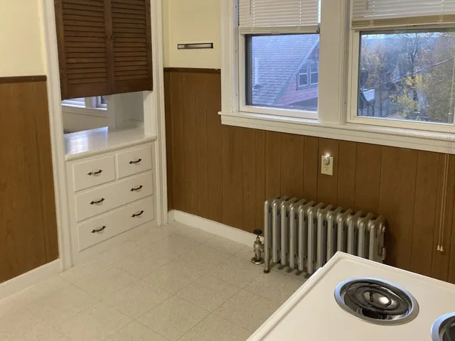 a view of an front door and cabinet