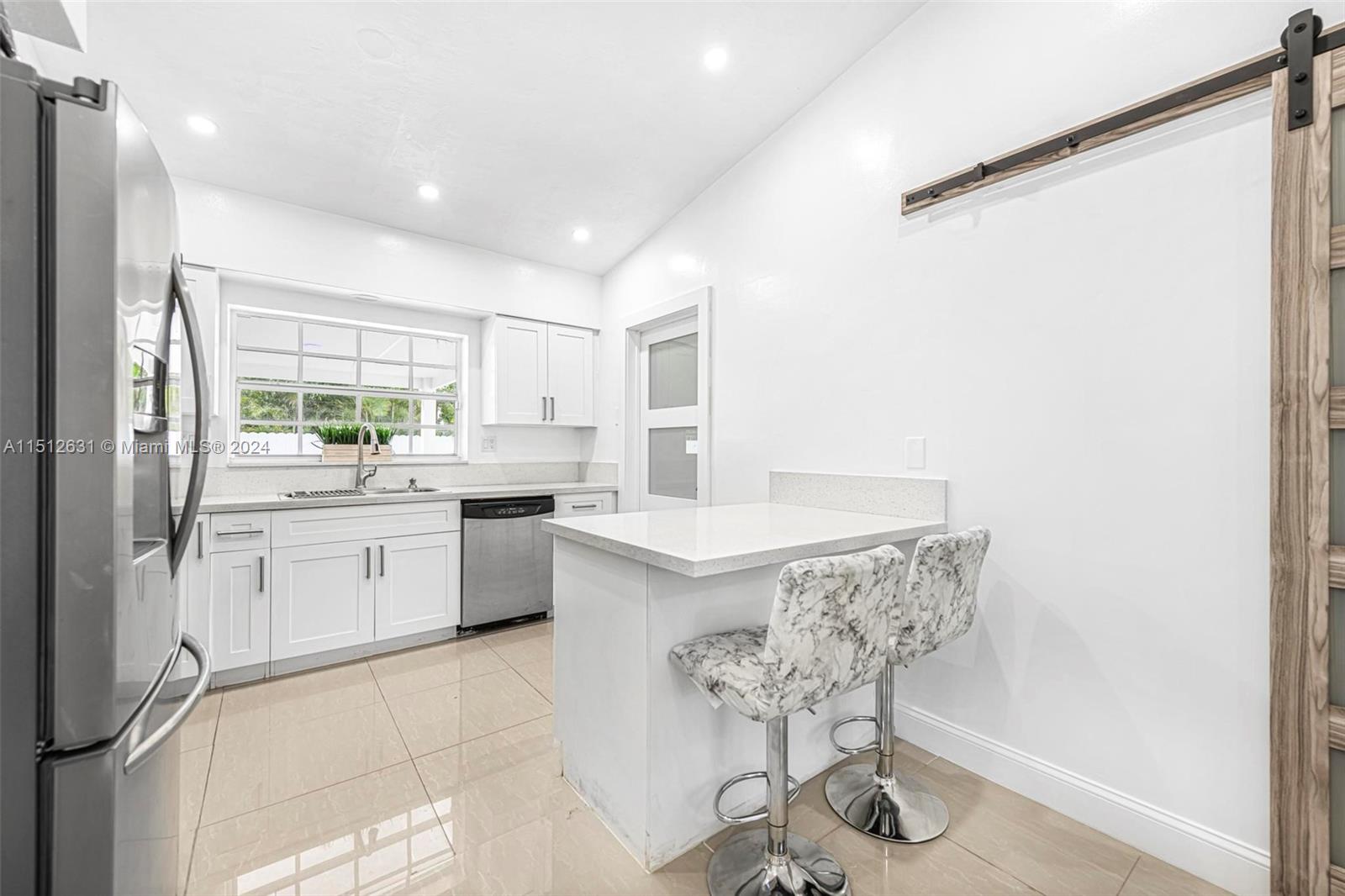 Palmetto Estates Miami, FL 33157 - Photo 11 of 29 a kitchen with a sink cabinets and window