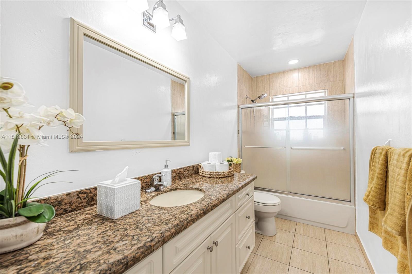 Palmetto Estates Miami, FL 33157 - Photo 16 of 29 a bathroom with a granite countertop sink a toilet and mirror