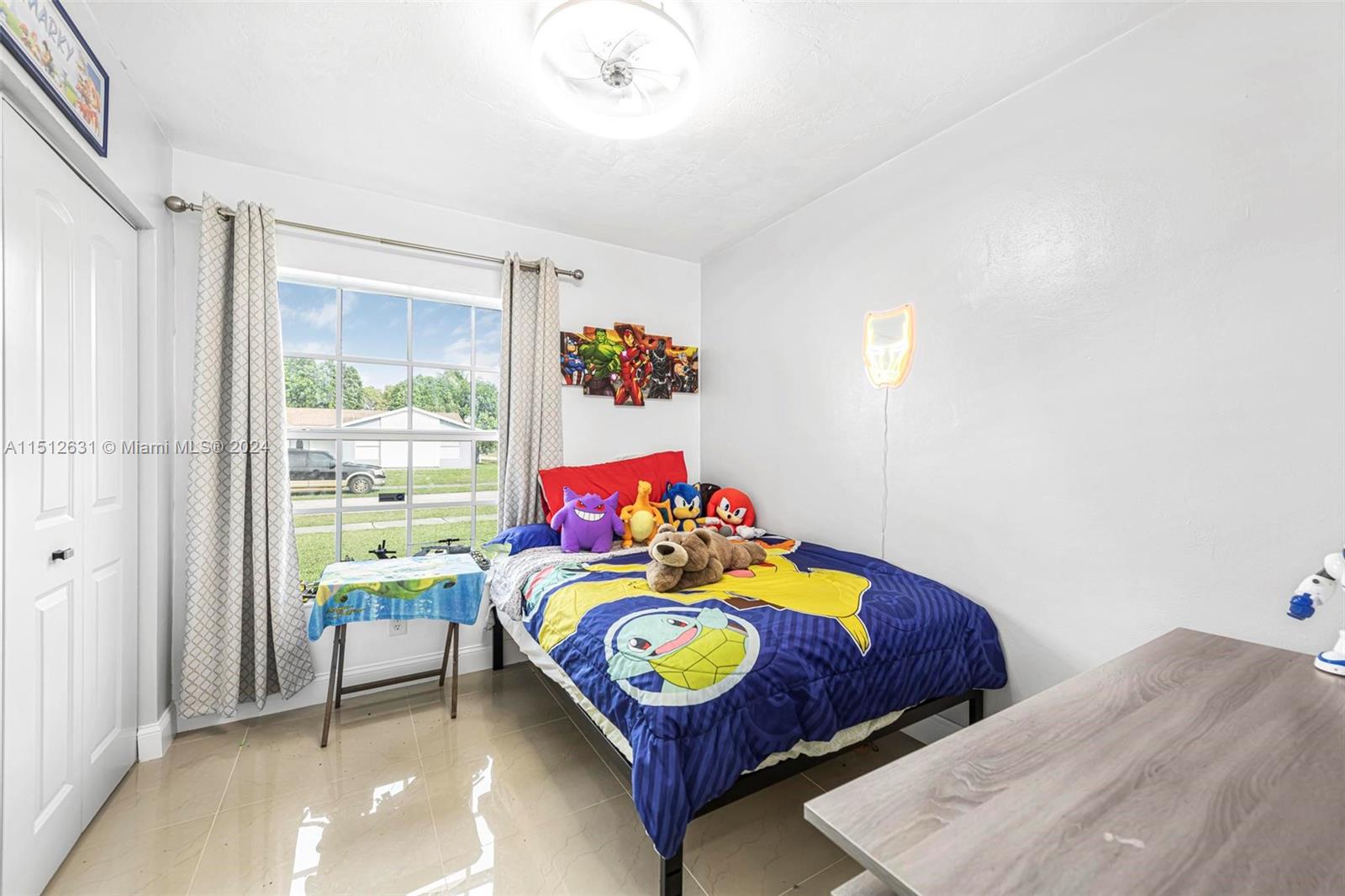 Palmetto Estates Miami, FL 33157 - Photo 17 of 29 a bedroom with a bed and a couch