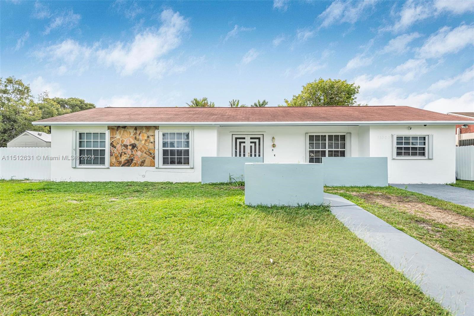 Palmetto Estates Miami, FL 33157 - Photo 2 of 29 a house view with a garden space
