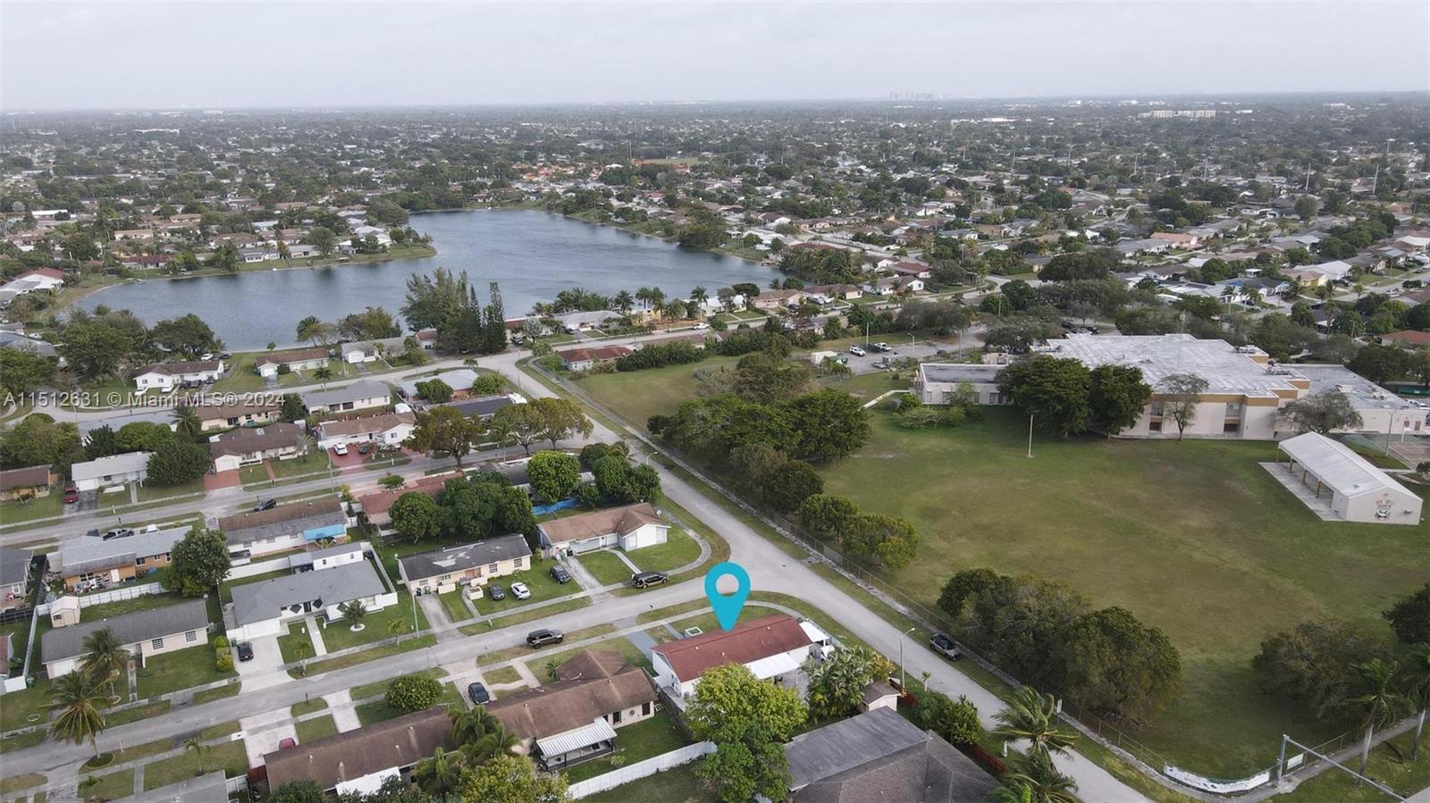 Palmetto Estates Miami, FL 33157 - Photo 28 of 29 an aerial view of residential houses with outdoor space and lake view