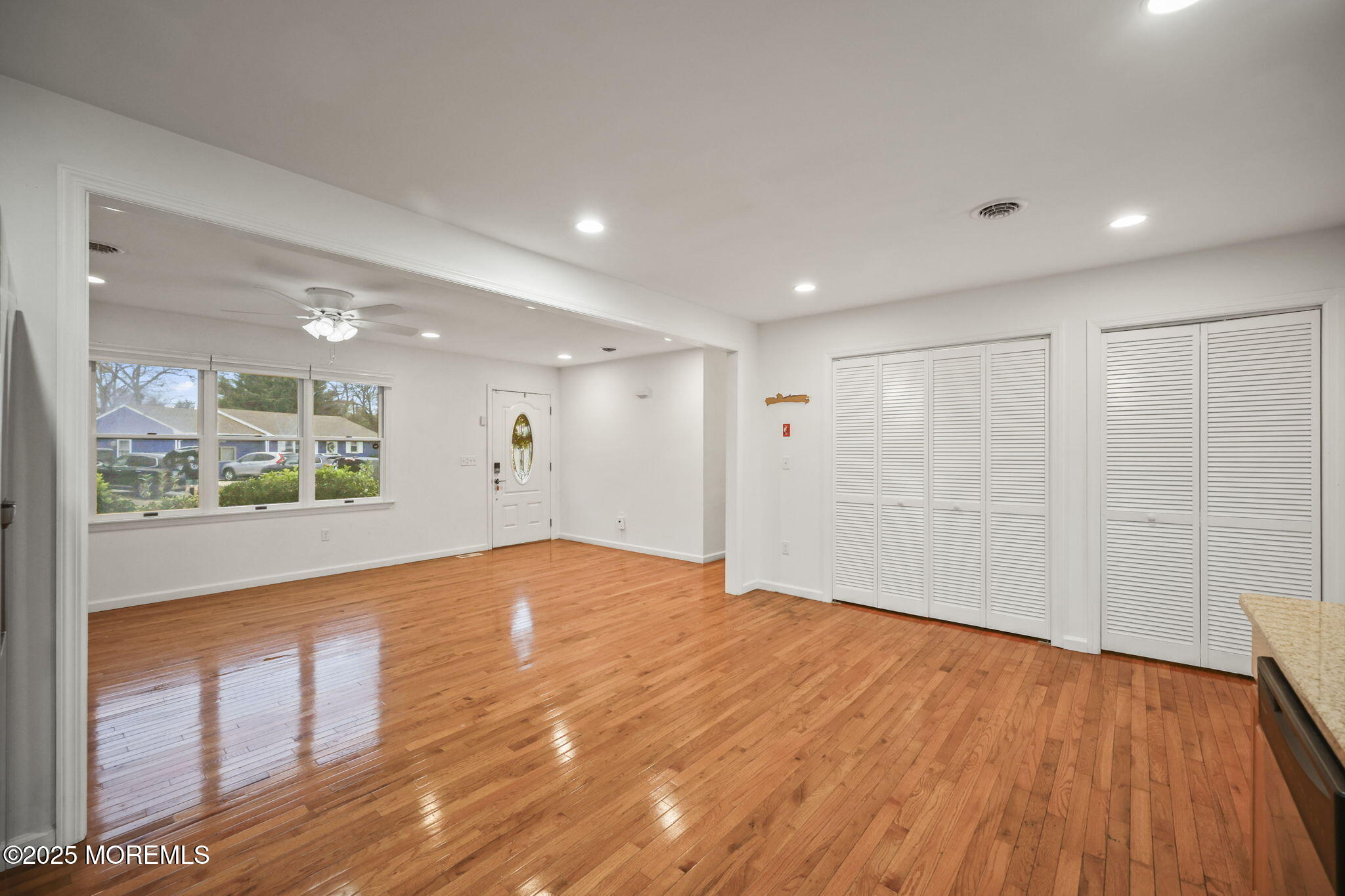601 Marshall Drive Point Pleasant, NJ 08742 - Photo 11 of 21 a view of an empty room with wooden floor and a window