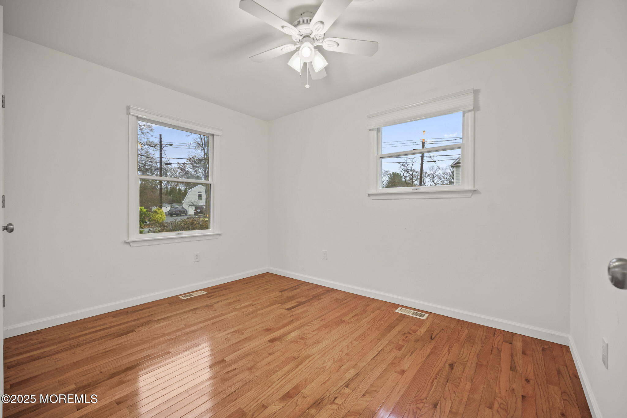 601 Marshall Drive Point Pleasant, NJ 08742 - Photo 13 of 21 a view of an empty room with window and wooden floor