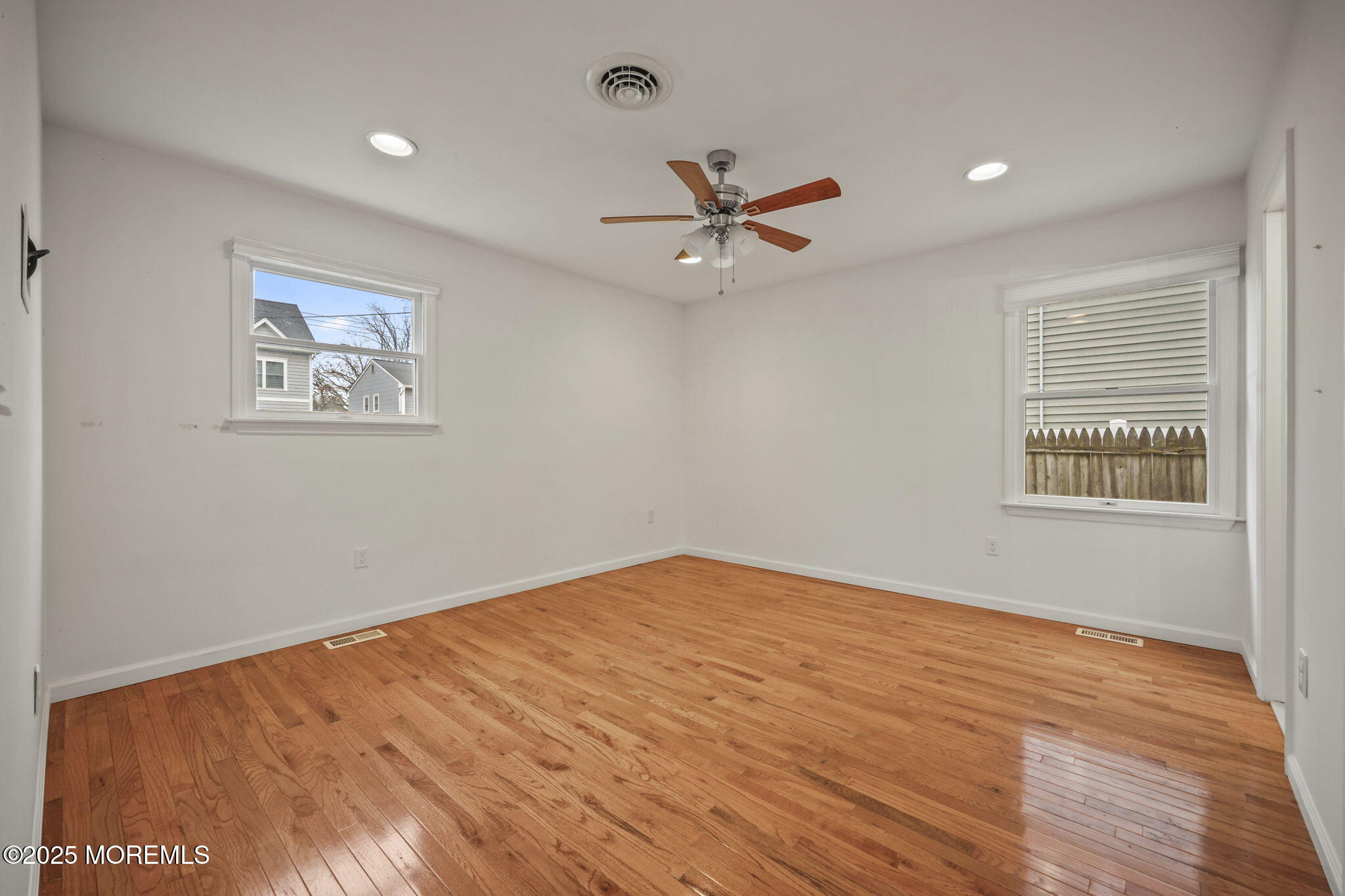 601 Marshall Drive Point Pleasant, NJ 08742 - Photo 14 of 21 wooden floor in an empty room with a window