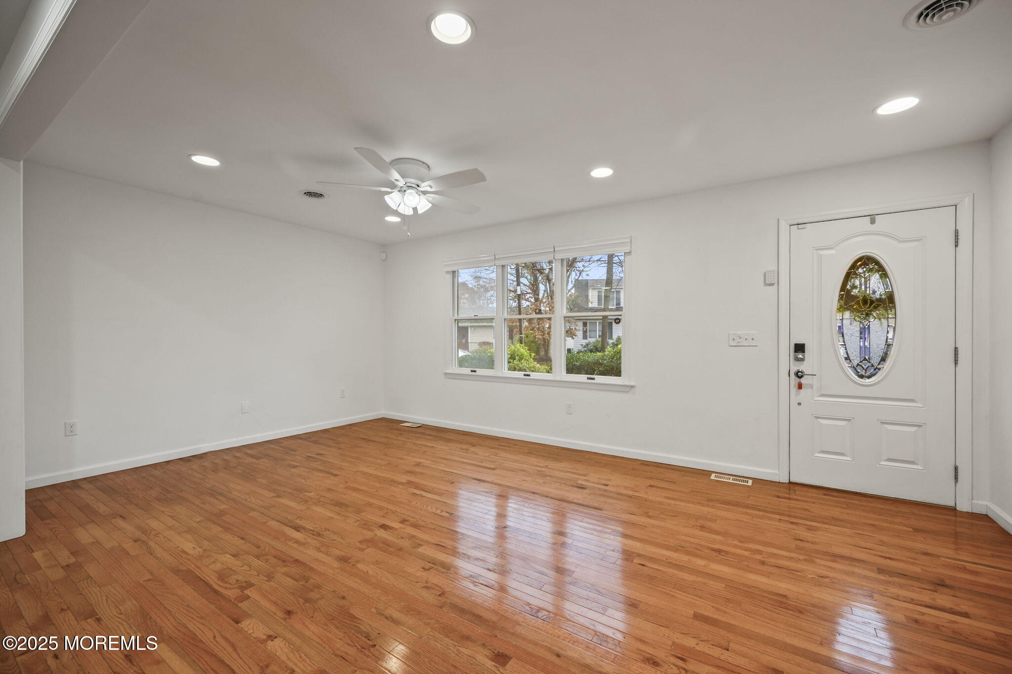 601 Marshall Drive Point Pleasant, NJ 08742 - Photo 7 of 21 wooden floor in an empty room with a window