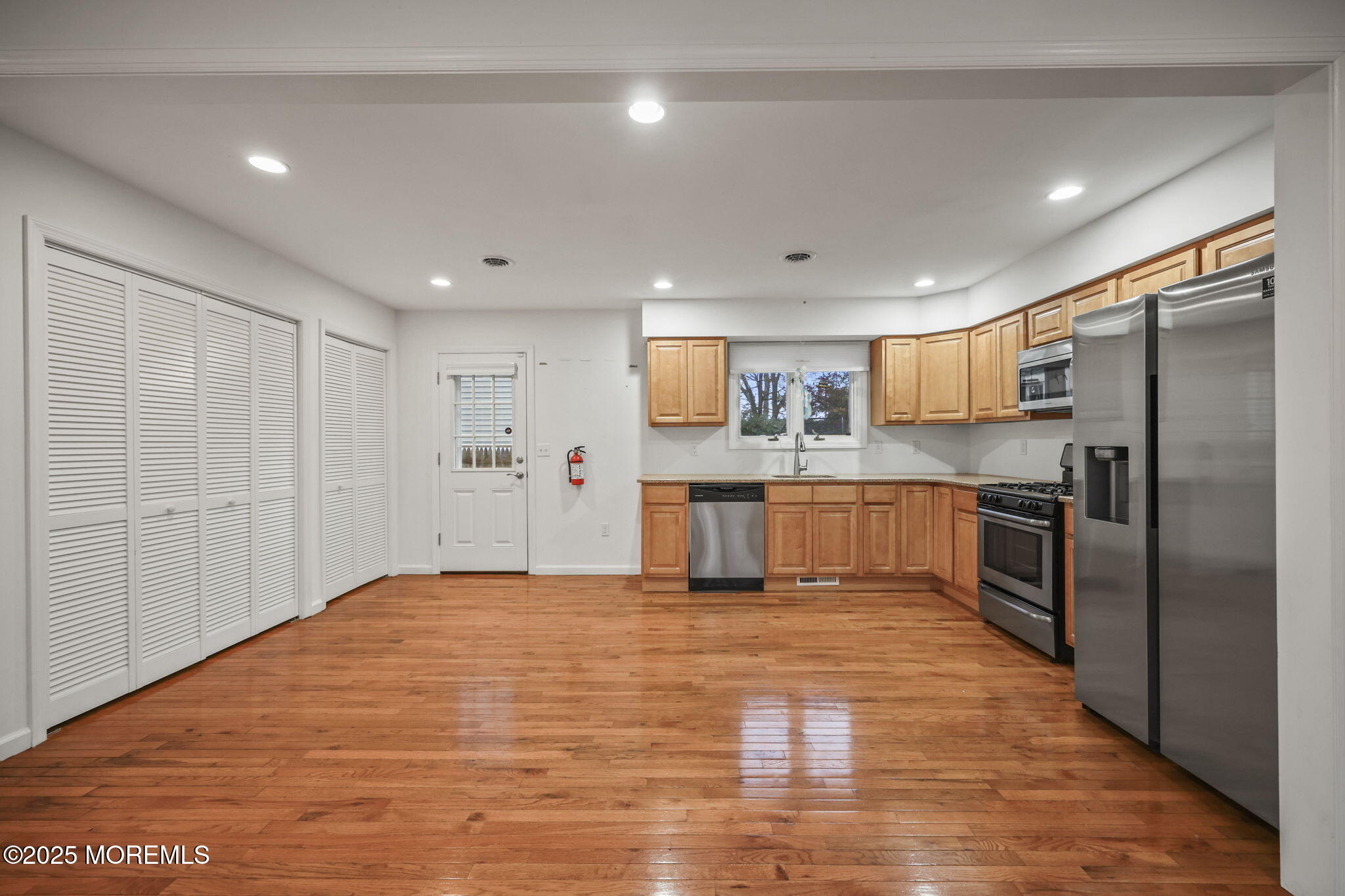 601 Marshall Drive Point Pleasant, NJ 08742 - Photo 8 of 21 a large kitchen with a refrigerator and a stove top oven
