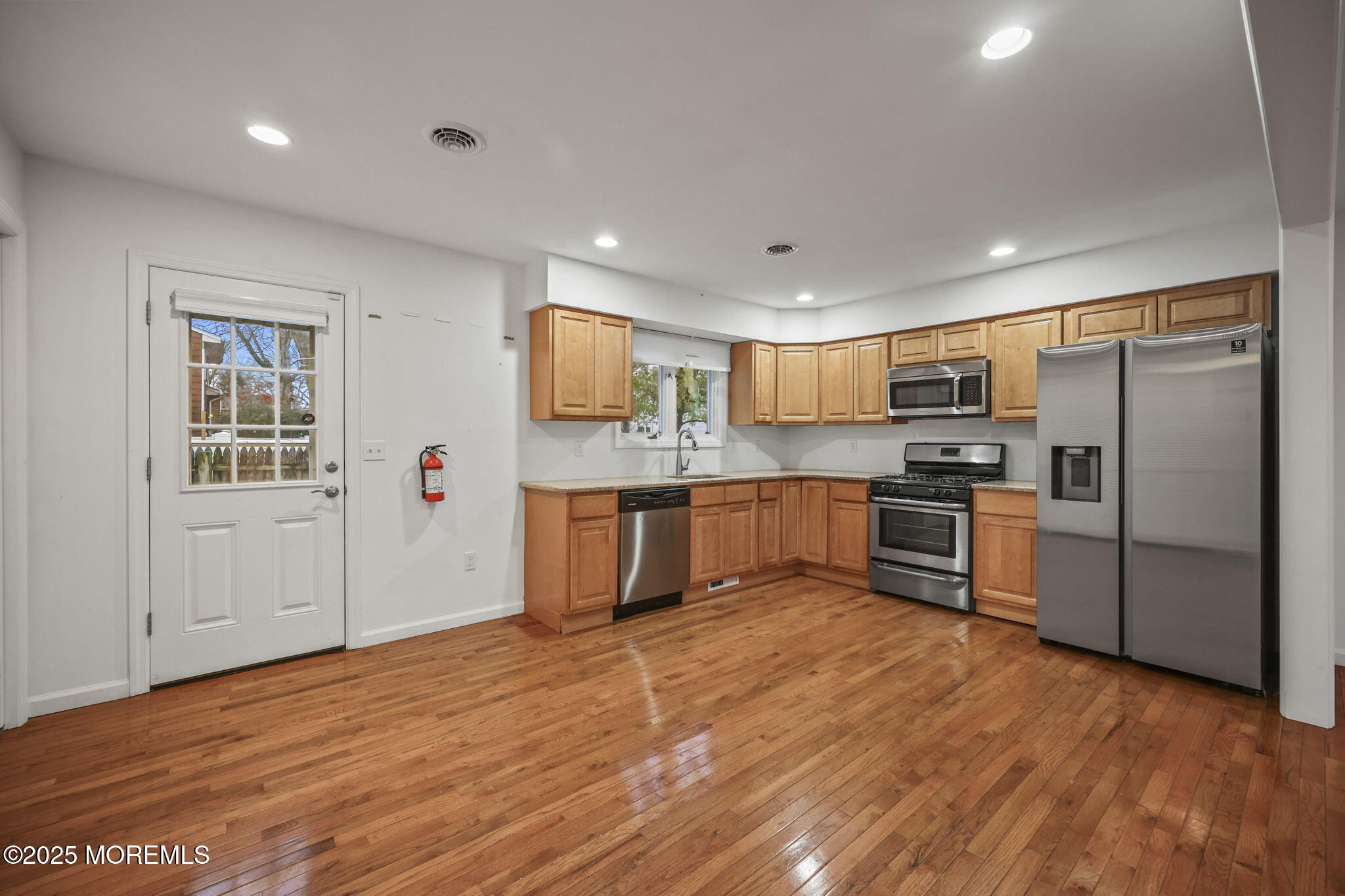 601 Marshall Drive Point Pleasant, NJ 08742 - Photo 9 of 21 a kitchen with granite countertop stainless steel appliances and refrigerator