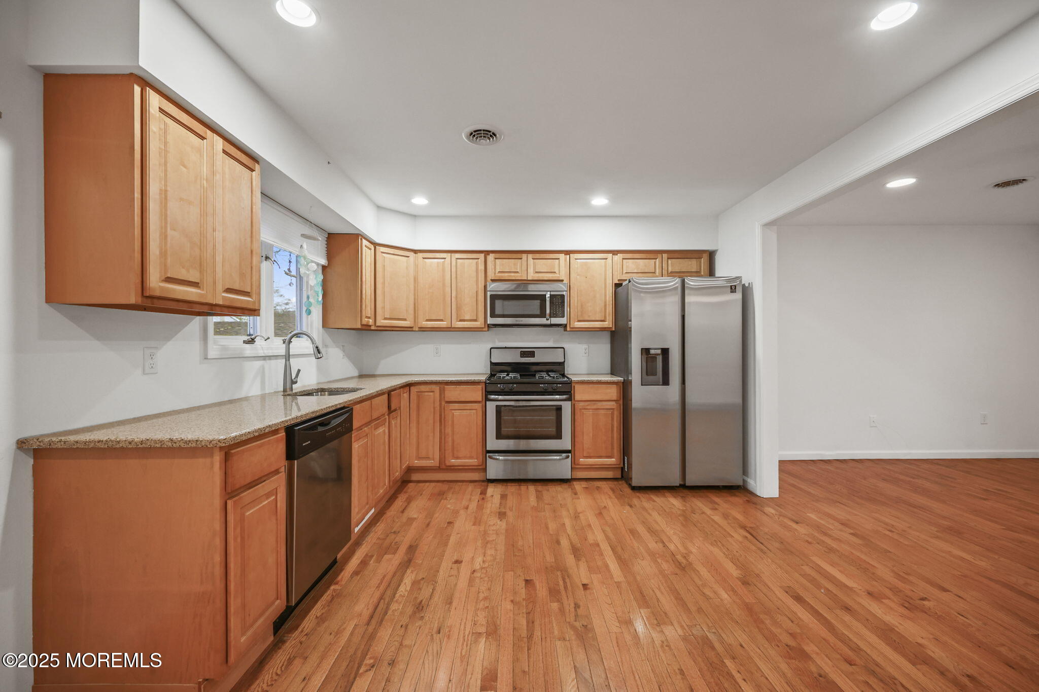601 Marshall Drive Point Pleasant, NJ 08742 - Photo 10 of 21 a kitchen with stainless steel appliances a refrigerator and a stove top oven